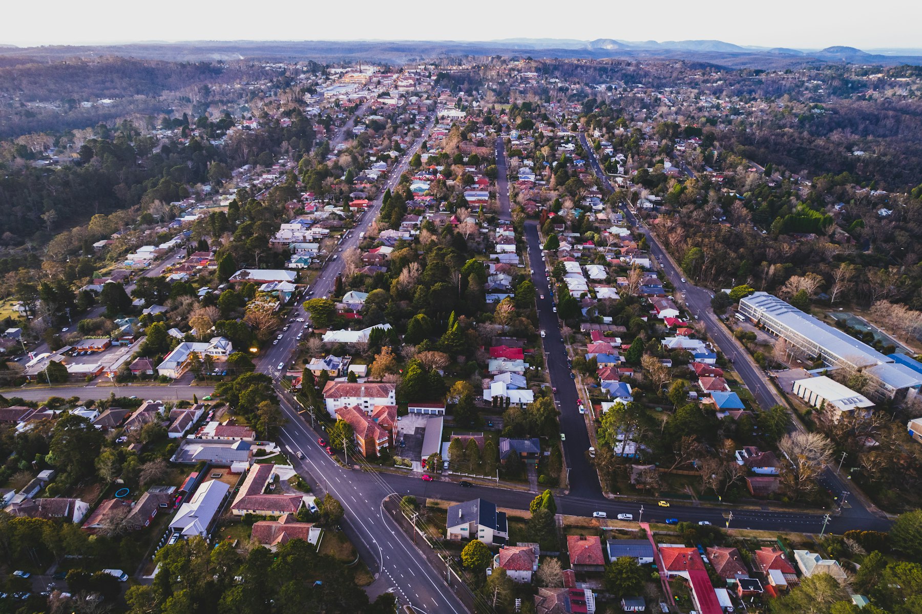 Aerial view of a town with roads and houses