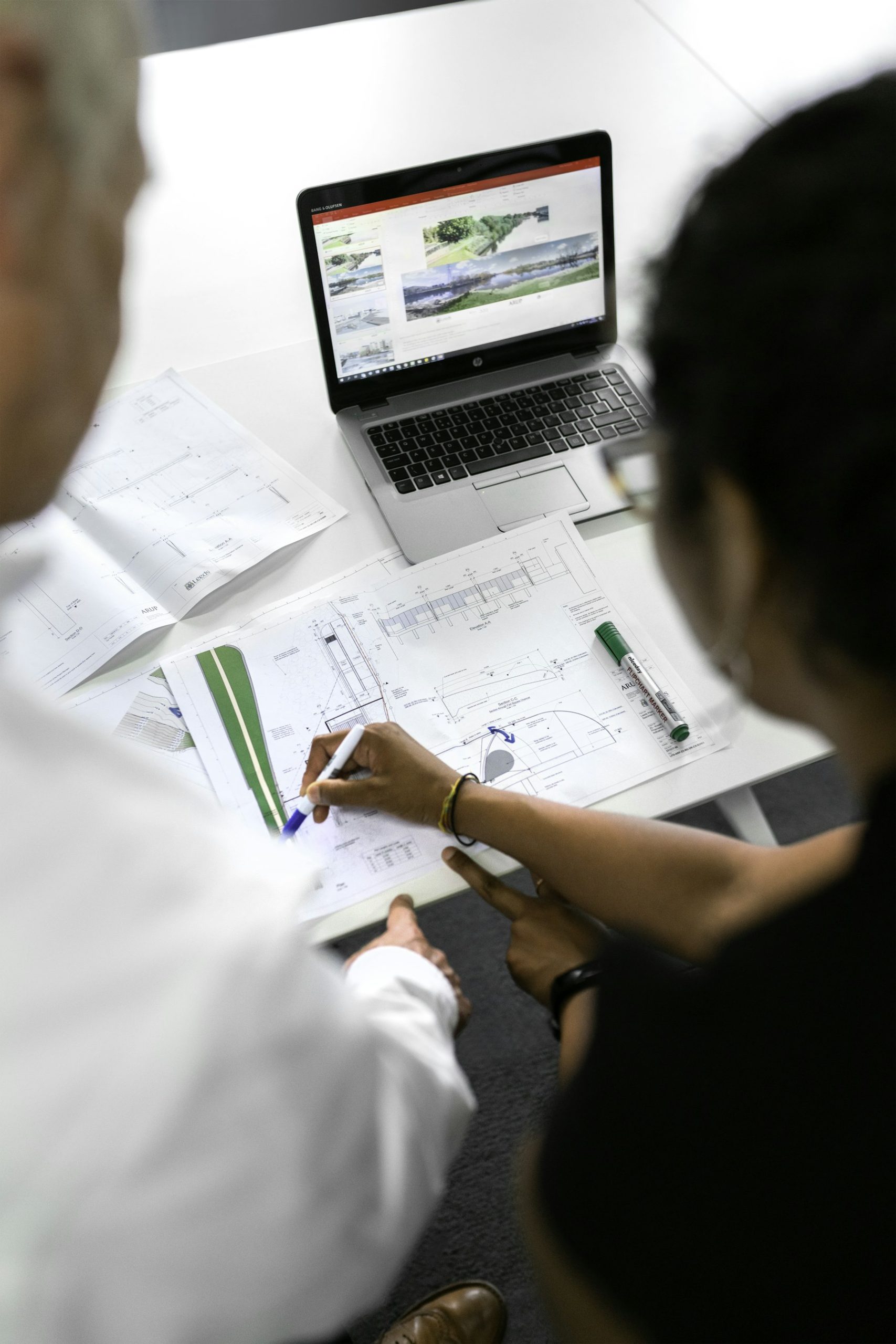 Engineer reviewing technical drawings