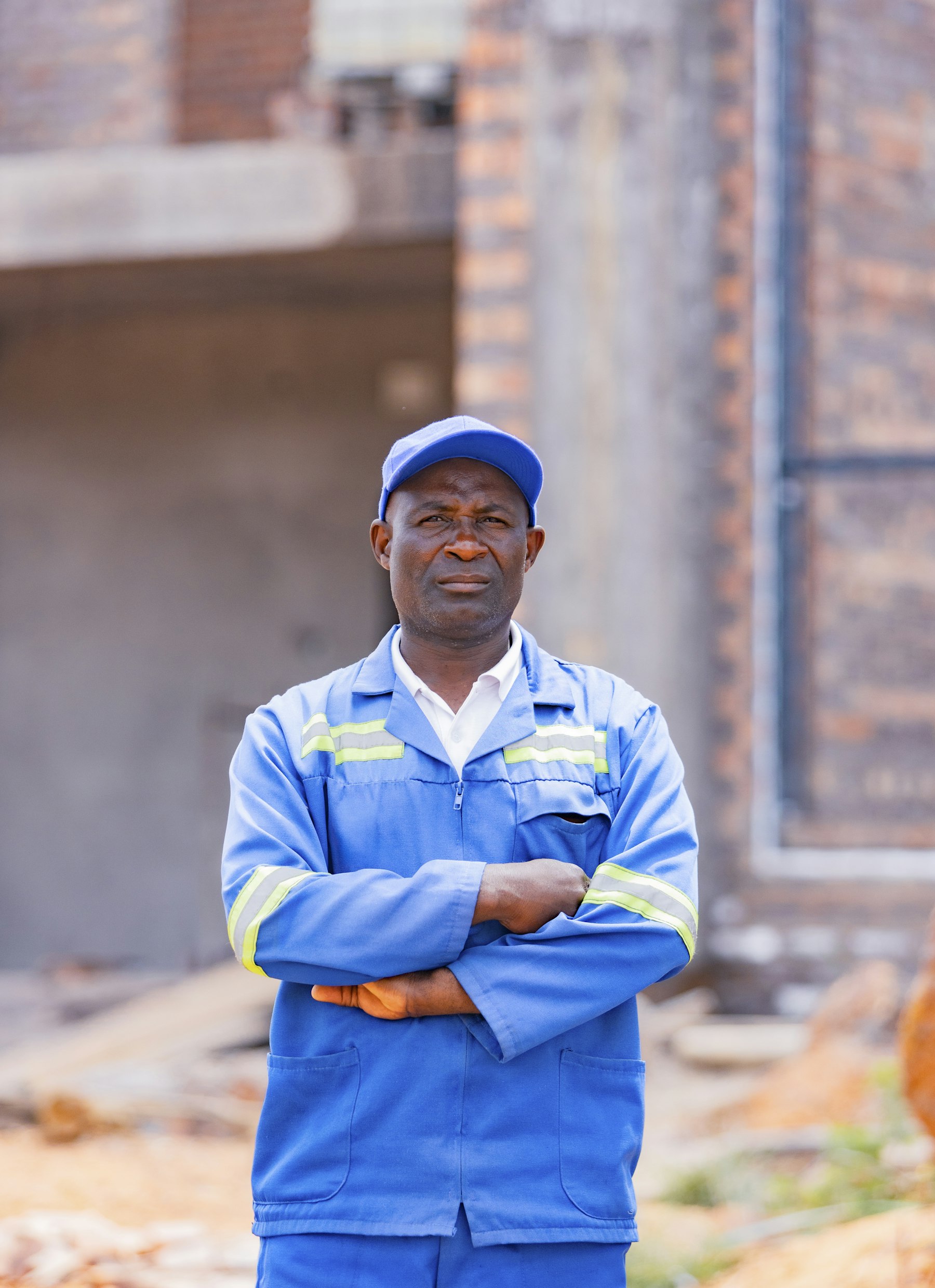 Tradesman standing with arms crossed