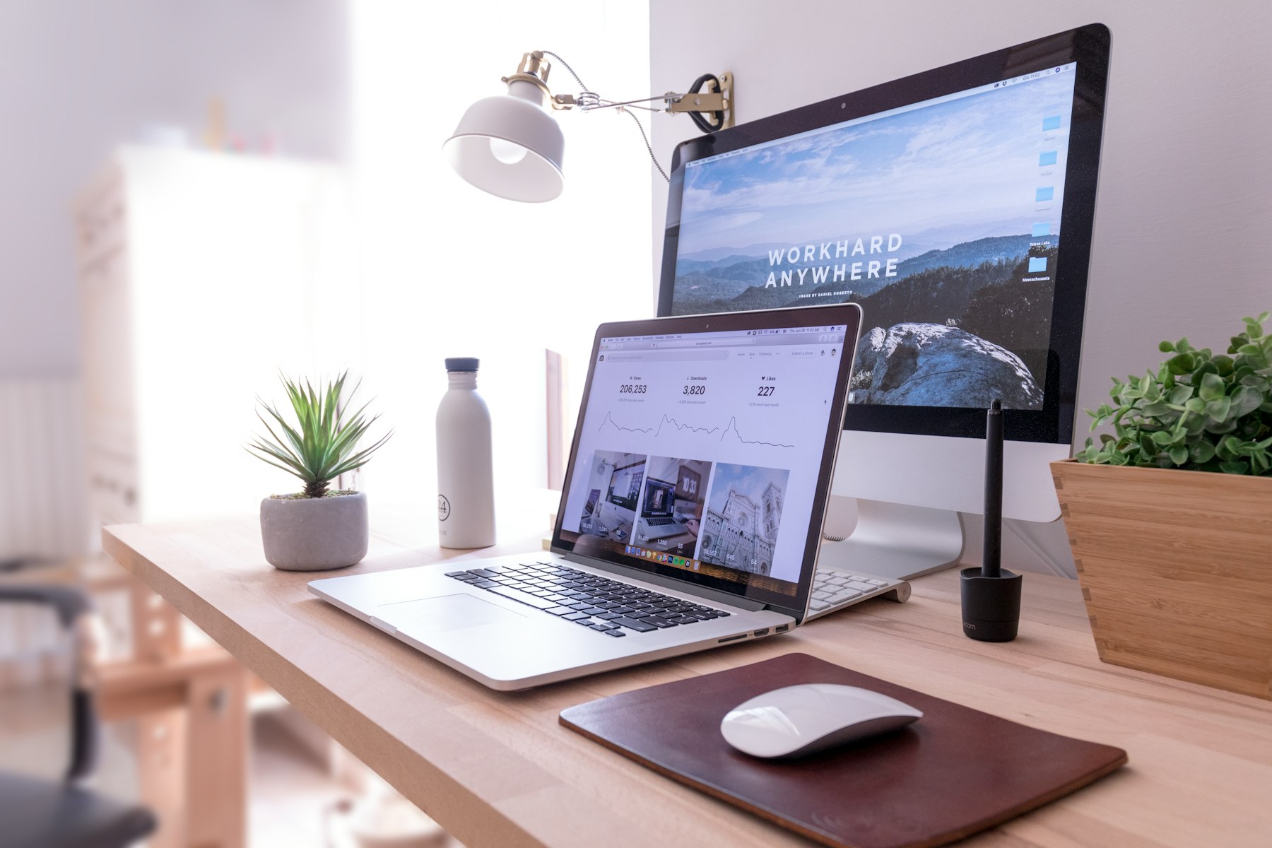 Tidy desk with an iMac set up for web design work