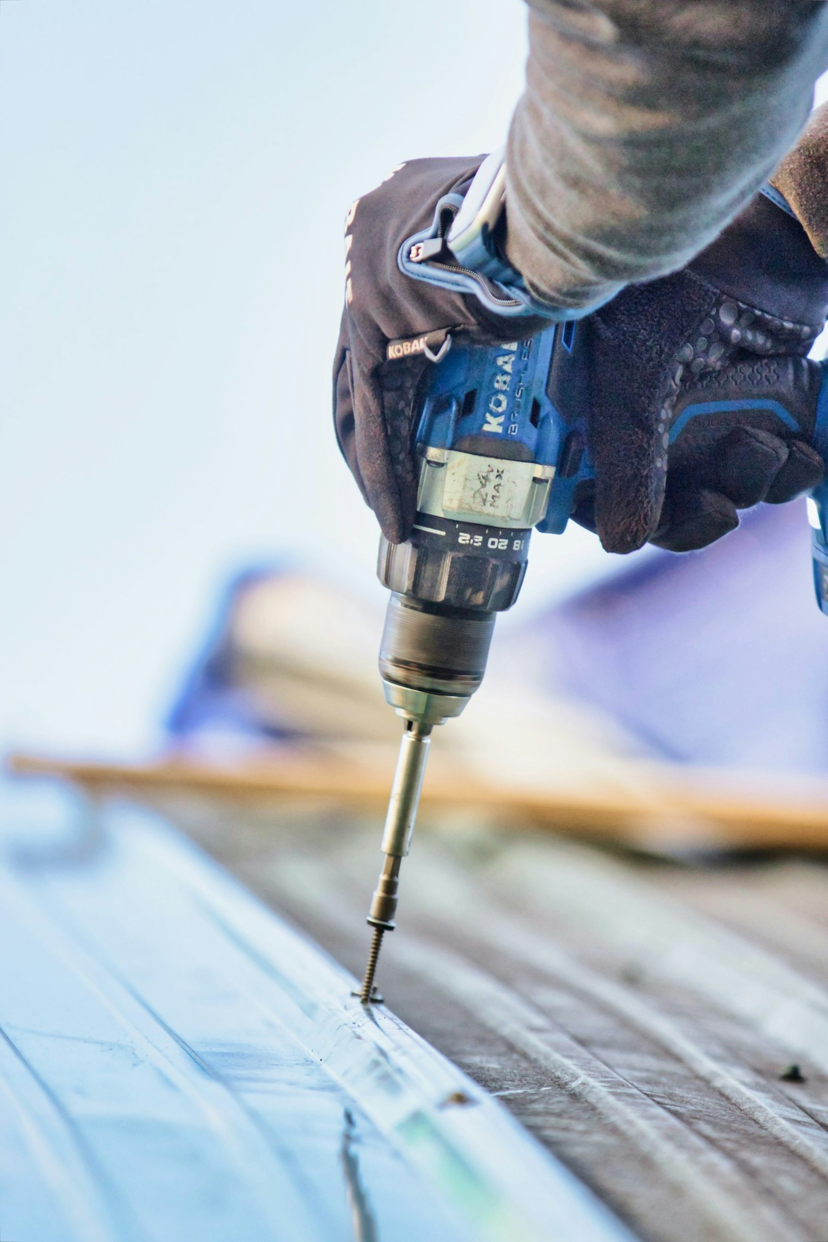 Tradie using a cordless drill