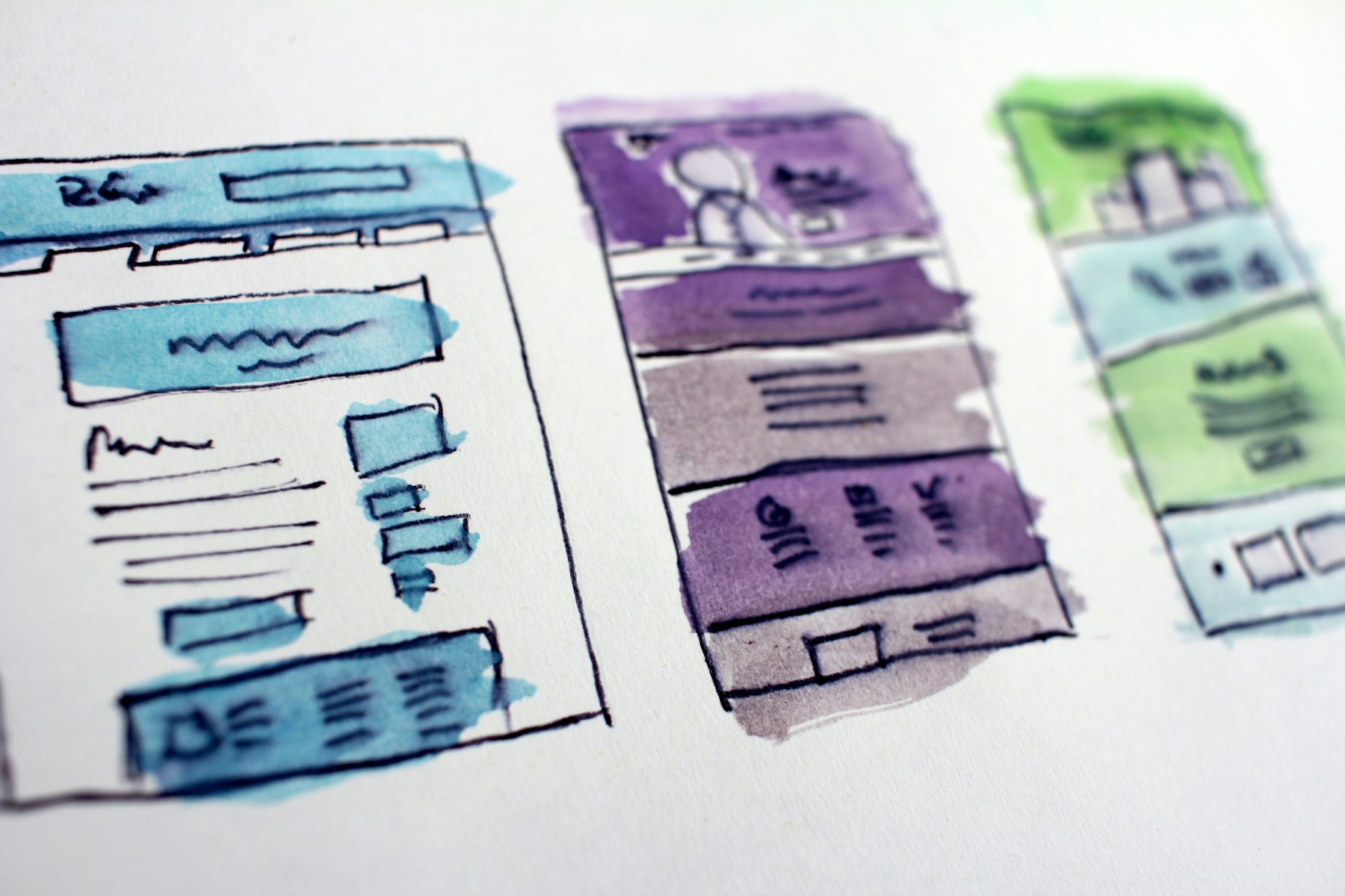 Website wireframes sketched on paper while planning a Darwin business site